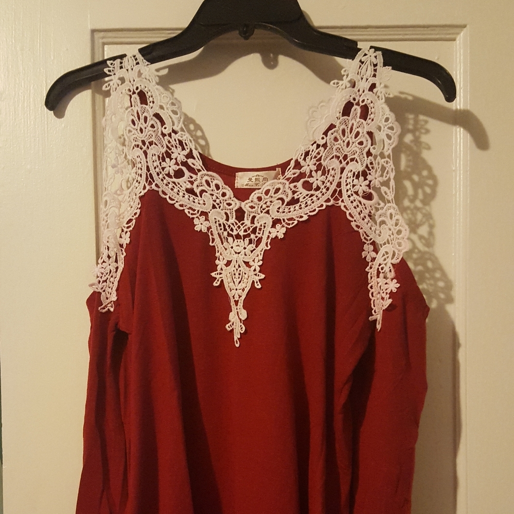 Long sleeve red blouse, open shoulder. Size M.